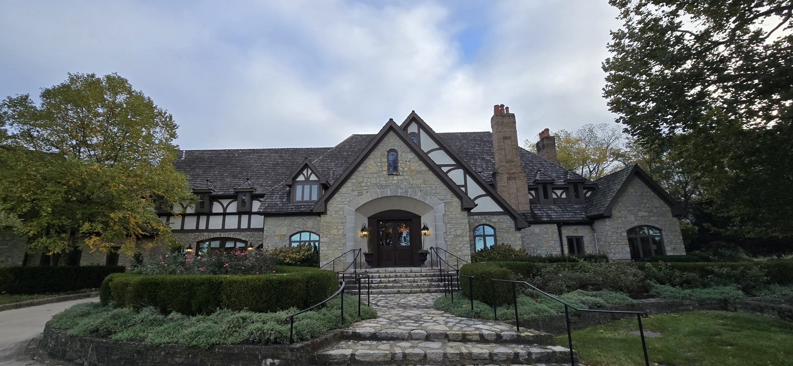 Front of tan tudor mansion for TCP Asset Management