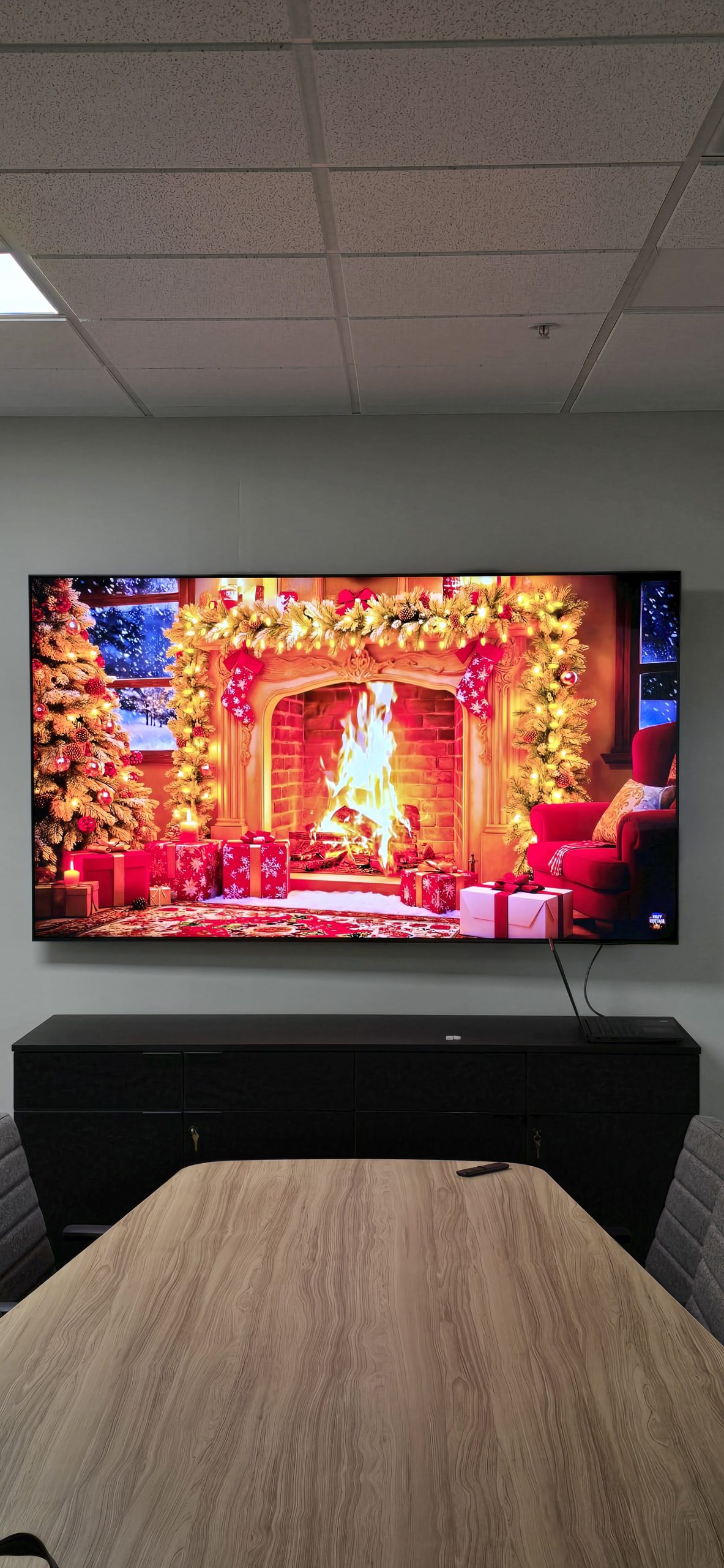 98" smart tv with structured wiring above table in conference room