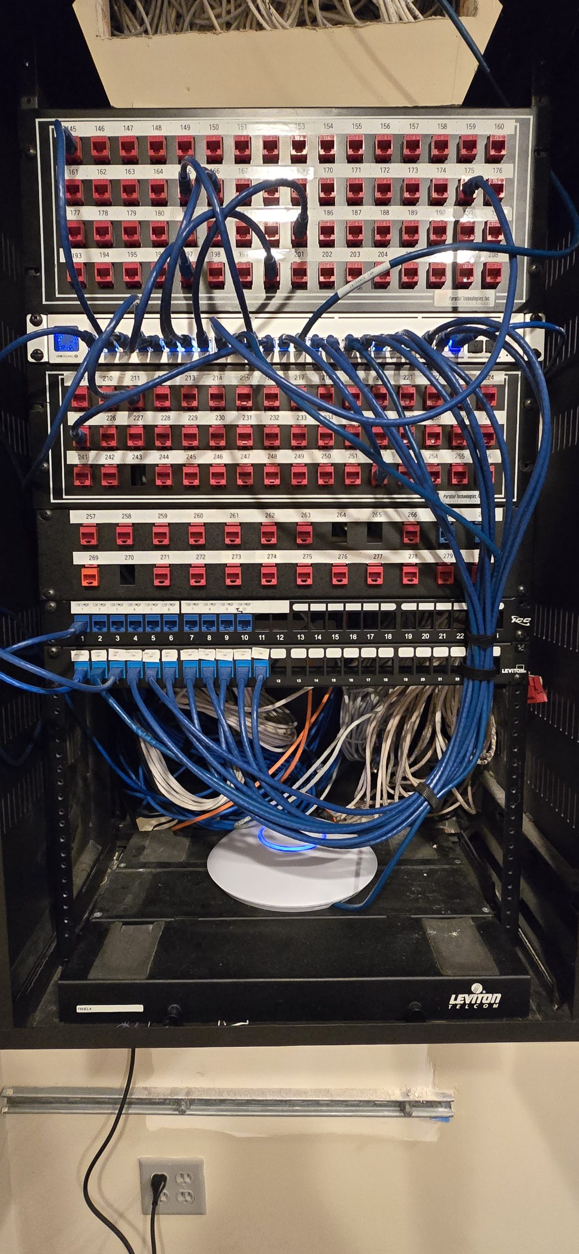 server rack and switch with ethernet patch cables