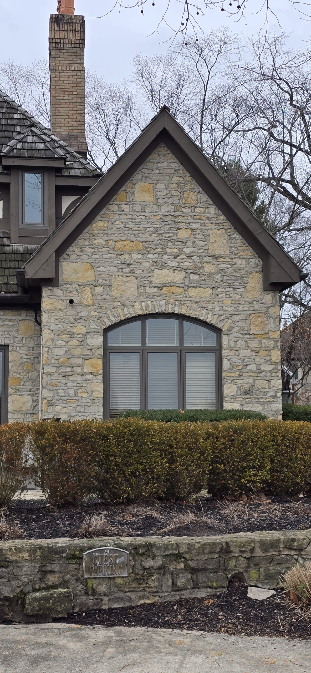 Outdoor security camera on brick wall of house