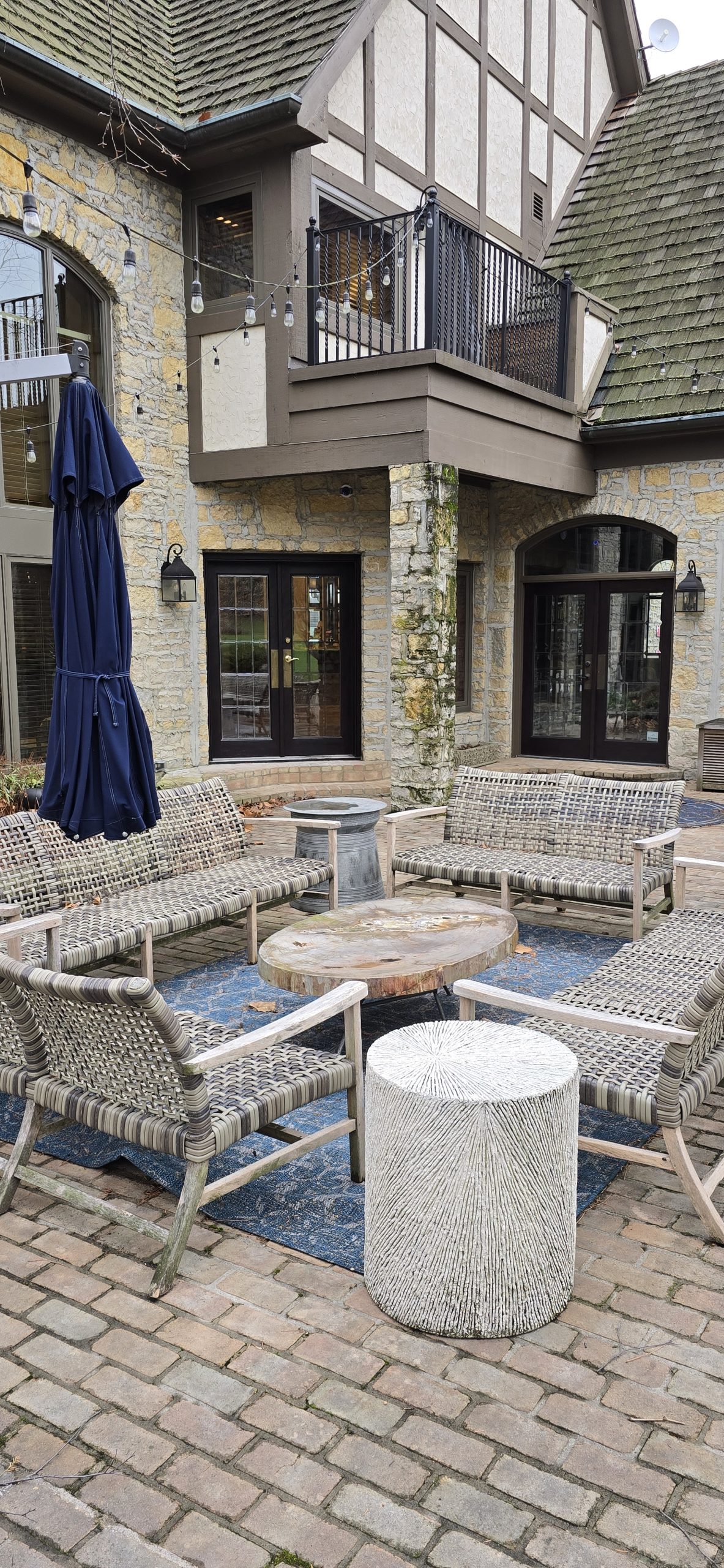 Brick patio with whicker furniture and security camera installation